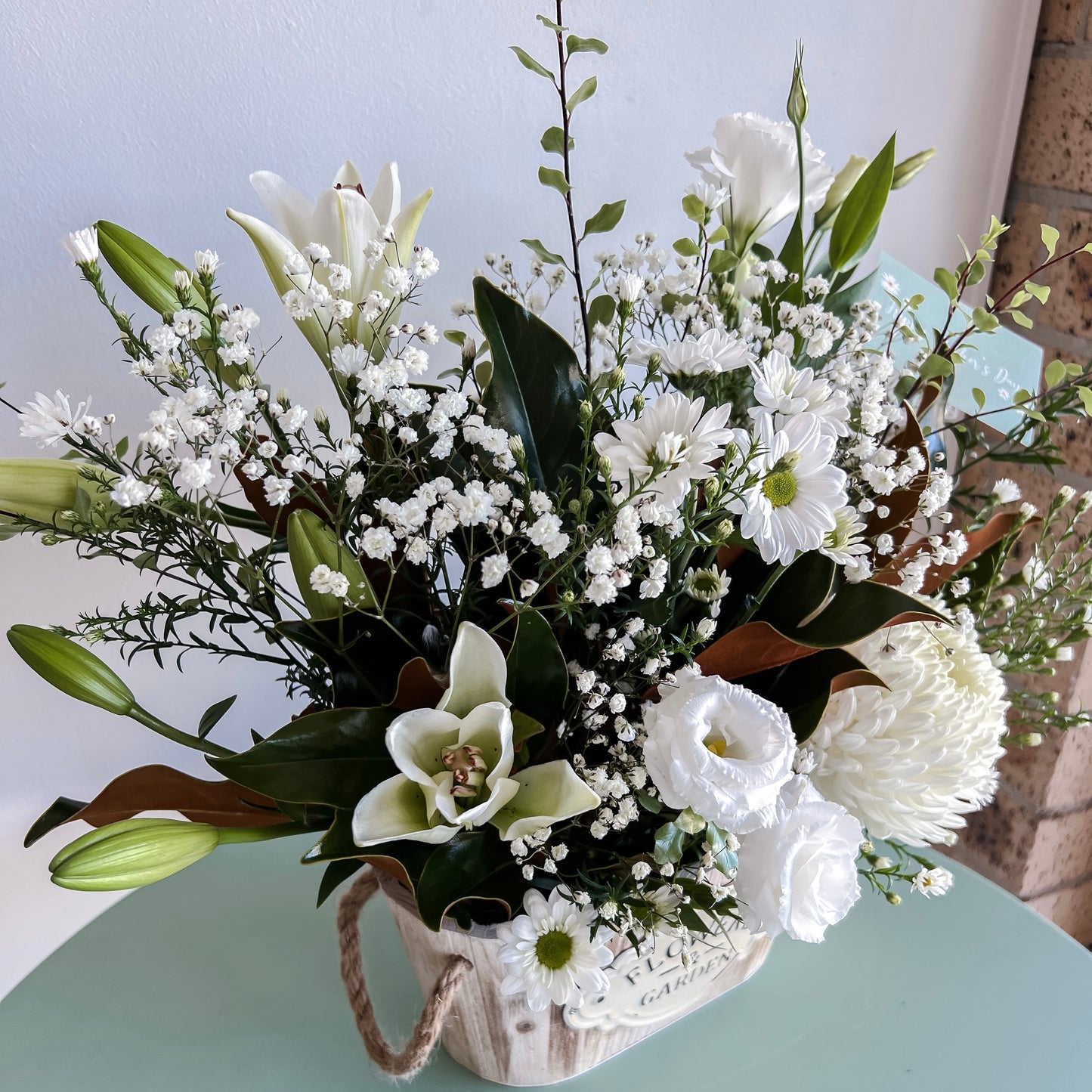 Flowers and Garden Crate Arrangement filled with White Seasonal Flowers And Greenery